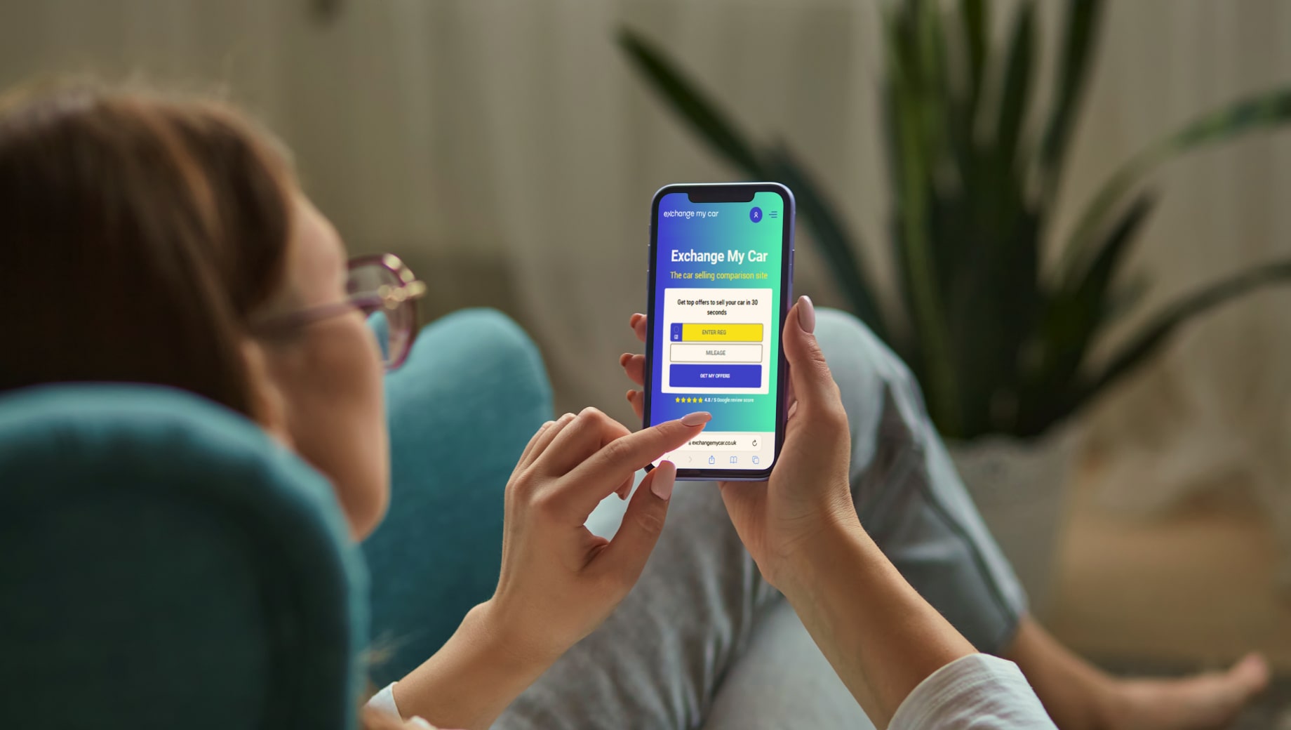 A person sitting in home and getting a free car valuation